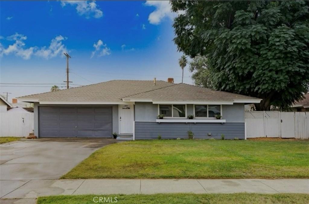 5332 Walter St, Riverside, CA 92504 - view of front of property featuring an attached garage, driveway, stucco siding, roof with shingles, and a gate