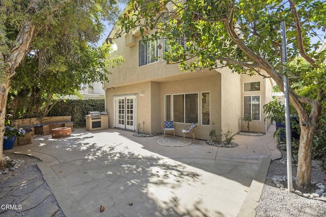 7748 Paso Robles St, Ventura, CA 93004 - rear view of house with stucco siding and a patio area