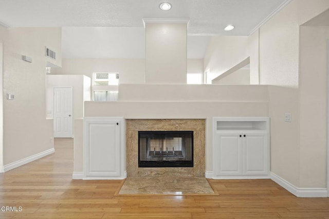 7748 Paso Robles St, Ventura, CA 93004 - detailed view of wood finished floors, recessed lighting, and a tile fireplace