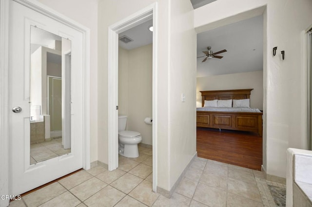 7748 Paso Robles St, Ventura, CA 93004 - ensuite bathroom featuring a stall shower, a ceiling fan, and tile patterned flooring