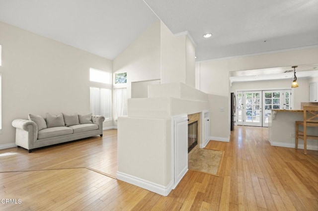 7748 Paso Robles St, Ventura, CA 93004 - living area with light wood finished floors, a fireplace, and recessed lighting