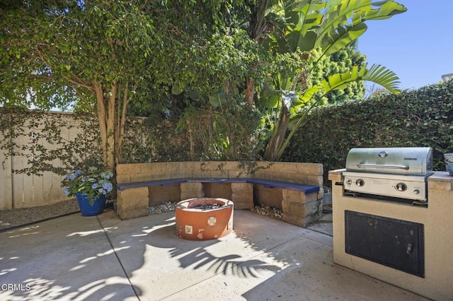 7748 Paso Robles St, Ventura, CA 93004 - view of patio featuring an outdoor fire pit and area for grilling