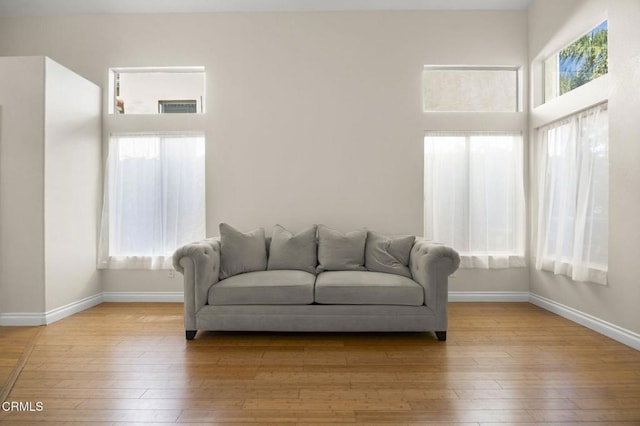7748 Paso Robles St, Ventura, CA 93004 - living area with baseboards and light wood-style floors