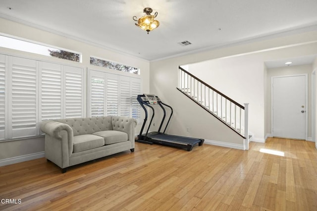 7748 Paso Robles St, Ventura, CA 93004 - exercise area featuring light wood-type flooring, crown molding, and healthy amount of natural light