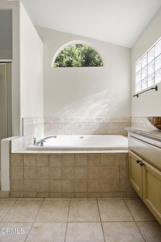 7748 Paso Robles St, Ventura, CA 93004 - full bathroom with healthy amount of natural light, vanity, a garden tub, and a shower with door