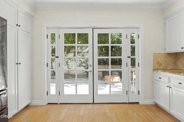 7748 Paso Robles St, Ventura, CA 93004 - doorway to outside with healthy amount of natural light, light wood-type flooring, and crown molding