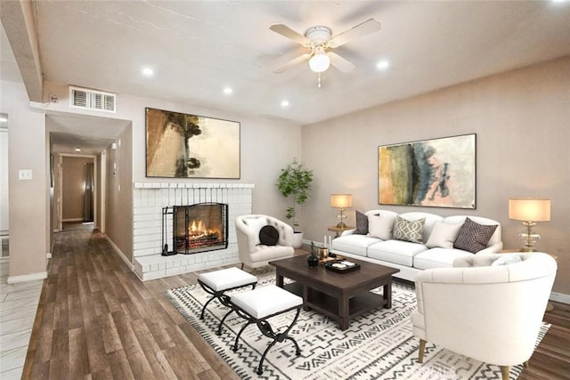 15722 Inyo St, Victorville, CA 92395 - living area with wood finished floors, ceiling fan, a fireplace, and recessed lighting