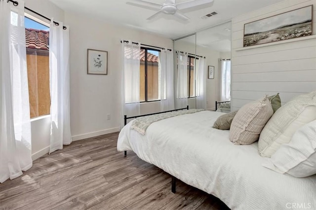 3010 Rosalinda Unit 50, San Clemente, CA 92673 - bedroom with wood finished floors, multiple windows, and ceiling fan