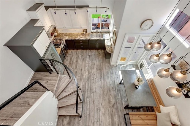 3010 Rosalinda Unit 50, San Clemente, CA 92673 - interior space with wood finished floors and a high ceiling