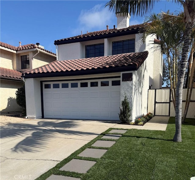 3010 Rosalinda Unit 50, San Clemente, CA 92673 - mediterranean / spanish-style house featuring driveway, stucco siding, a garage, and a tiled roof