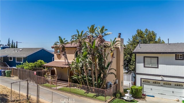 21460 Arapahoe Trl, Chatsworth, CA 91311 - view of front of home with a garage