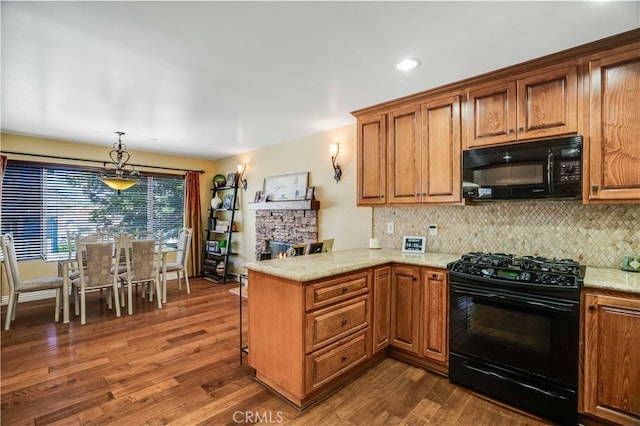 21460 Arapahoe Trl, Chatsworth, CA 91311 - kitchen with black appliances, a peninsula, backsplash, dark wood finished floors, and recessed lighting