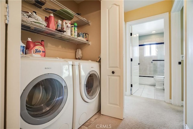21460 Arapahoe Trl, Chatsworth, CA 91311 - laundry area featuring light colored carpet, washing machine and clothes dryer, and light tile patterned floors
