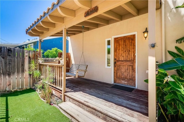 21460 Arapahoe Trl, Chatsworth, CA 91311 - doorway to property featuring stucco siding and a wooden deck