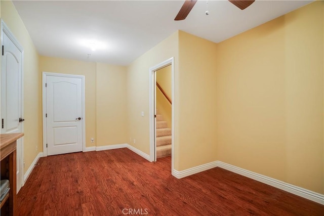 21460 Arapahoe Trl, Chatsworth, CA 91311 - spare room featuring wood finished floors, ceiling fan, and stairway