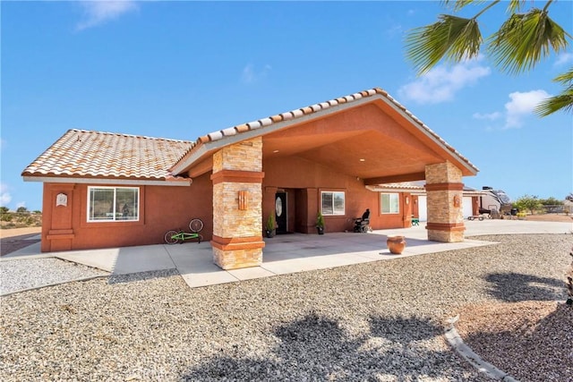 9512 Mesquite St, Phelan, CA 92371 - rear view of property with a tiled roof and stucco siding