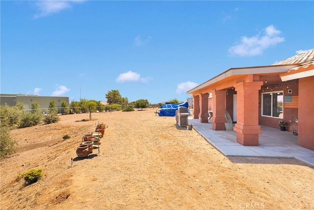 9512 Mesquite St, Phelan, CA 92371 - view of yard featuring a patio area