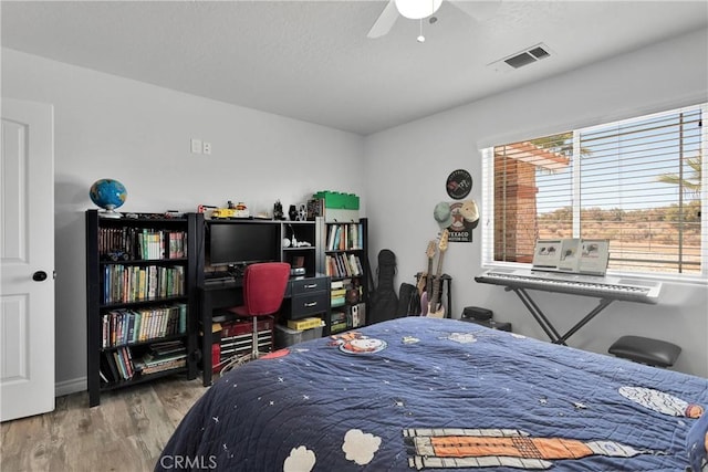 9512 Mesquite St, Phelan, CA 92371 - bedroom with wood finished floors and baseboards