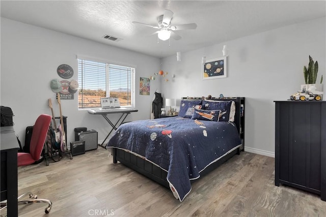 9512 Mesquite St, Phelan, CA 92371 - bedroom with wood finished floors and ceiling fan