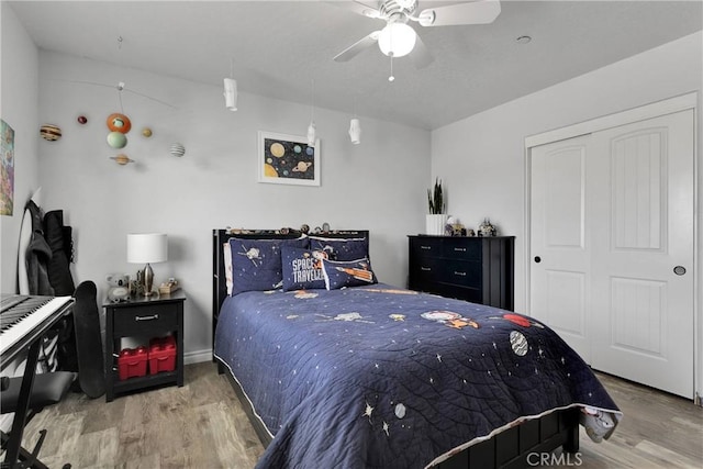 9512 Mesquite St, Phelan, CA 92371 - bedroom with wood finished floors, a closet, and a ceiling fan