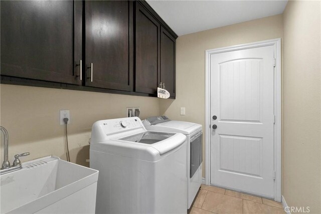 9512 Mesquite St, Phelan, CA 92371 - laundry area featuring cabinet space, independent washer and dryer, and light tile patterned flooring