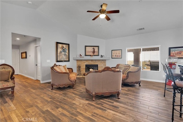 9512 Mesquite St, Phelan, CA 92371 - living area featuring lofted ceiling, ceiling fan, wood finished floors, and a stone fireplace