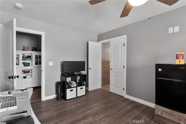 9512 Mesquite St, Phelan, CA 92371 - game room with ceiling fan, dark wood-type flooring, and a desk