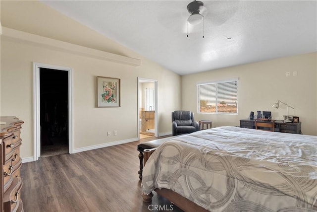 9512 Mesquite St, Phelan, CA 92371 - bedroom with dark wood-style floors, vaulted ceiling, and connected bathroom