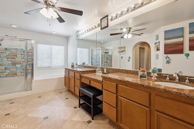 27597 Lafayette Way, Moreno Valley, CA 92555 - full bath with a ceiling fan, a shower stall, a bath, vanity, and tile patterned flooring