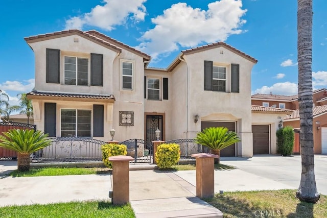 27597 Lafayette Way, Moreno Valley, CA 92555 - mediterranean / spanish-style home with stucco siding, a fenced front yard, and concrete driveway