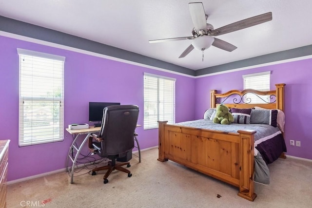 27597 Lafayette Way, Moreno Valley, CA 92555 - bedroom featuring multiple windows, light colored carpet, a ceiling fan, and an office area