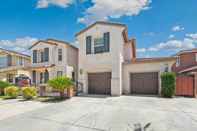 27597 Lafayette Way, Moreno Valley, CA 92555 - mediterranean / spanish house with concrete driveway, stucco siding, a tiled roof, and an attached garage