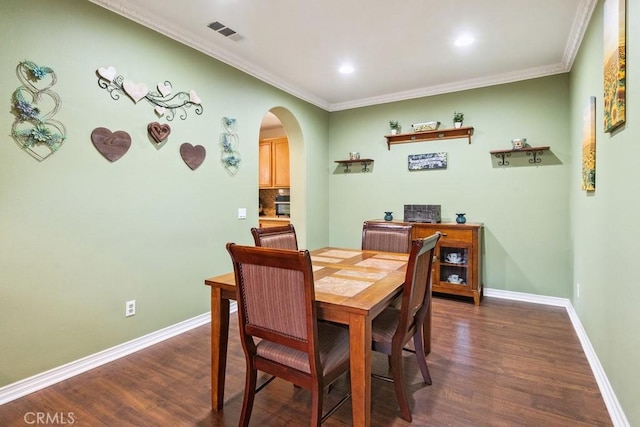 27597 Lafayette Way, Moreno Valley, CA 92555 - dining area with arched walkways, dark wood finished floors, ornamental molding, and recessed lighting