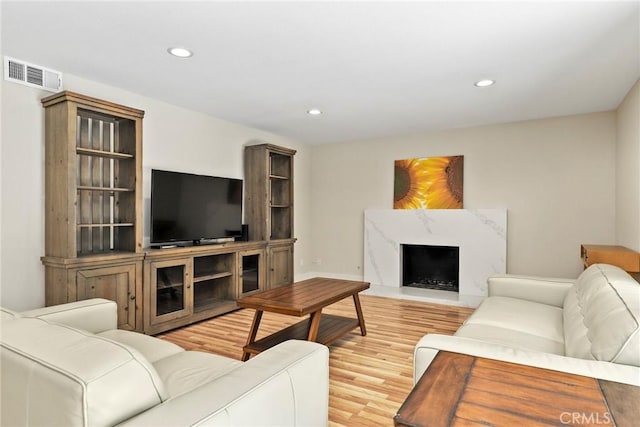 3420 Marna Ave, Long Beach, CA 90808 - living room with wood finished floors, recessed lighting, and a premium fireplace