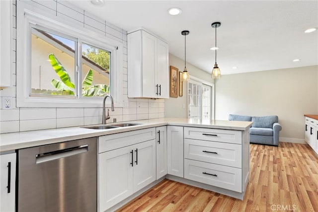 3420 Marna Ave, Long Beach, CA 90808 - kitchen featuring stainless steel dishwasher, open floor plan, light countertops, light wood-type flooring, and backsplash