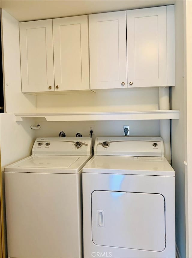 3130 Via Serena N Unit B, Laguna Woods, CA 92637 - laundry area featuring washer and clothes dryer and cabinet space