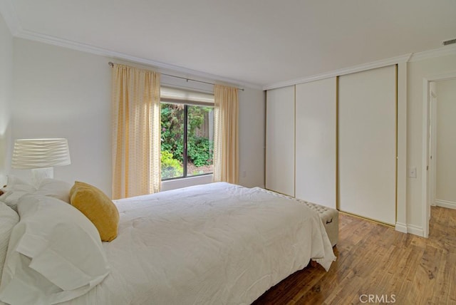 3130 Via Serena N Unit B, Laguna Woods, CA 92637 - bedroom with ornamental molding, wood finished floors, and a closet