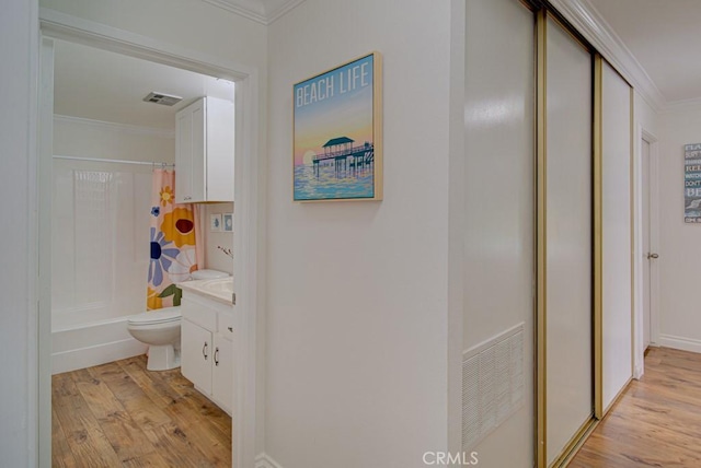 3130 Via Serena N Unit B, Laguna Woods, CA 92637 - hall with crown molding and light wood-type flooring