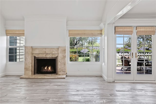 2720 Hilltop Dr Unit 58, Newport Beach, CA 92660 - unfurnished living room featuring plenty of natural light, a tile fireplace, and wood finished floors