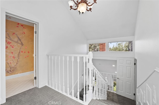 2720 Hilltop Dr Unit 58, Newport Beach, CA 92660 - carpeted foyer with a chandelier, tile patterned flooring, and high vaulted ceiling