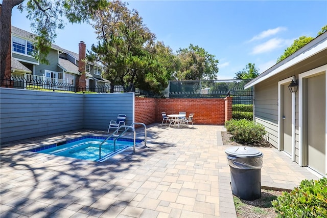 2720 Hilltop Dr Unit 58, Newport Beach, CA 92660 - view of swimming pool with a fenced backyard, a community hot tub, a patio, a residential view, and outdoor dining area