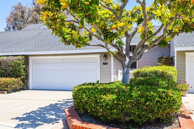 2720 Hilltop Dr Unit 58, Newport Beach, CA 92660 - view of front facade with a shingled roof, a garage, and driveway
