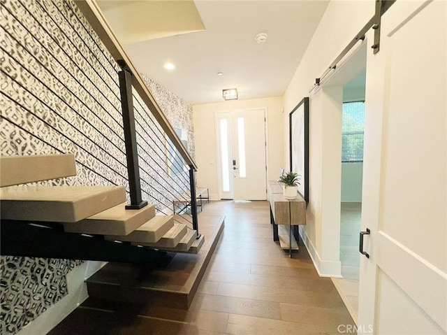 753 Site Dr, Brea, CA 92821 - foyer entrance with wood finished floors, an accent wall, recessed lighting, and a barn door