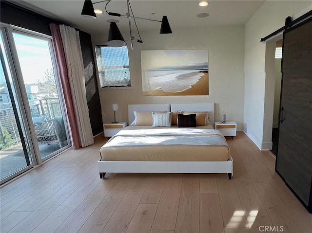 753 Site Dr, Brea, CA 92821 - bedroom featuring access to exterior, a barn door, and wood finished floors