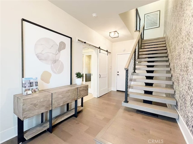 753 Site Dr, Brea, CA 92821 - stairs with a barn door and wood finished floors