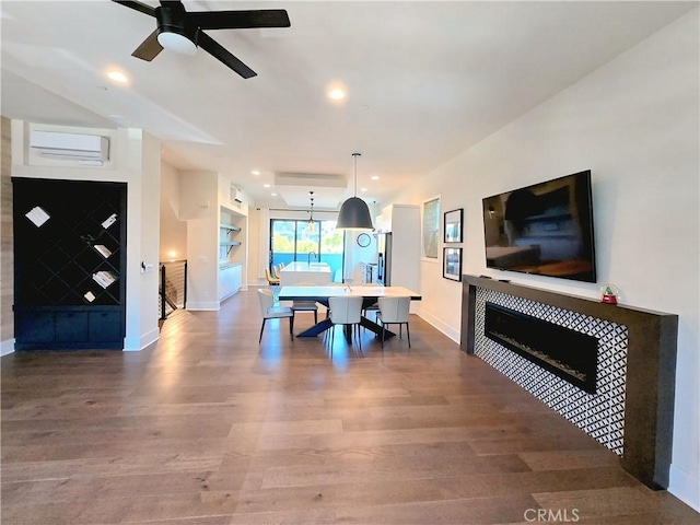 753 Site Dr, Brea, CA 92821 - dining area featuring a fireplace, wood finished floors, a wall unit AC, recessed lighting, and ceiling fan