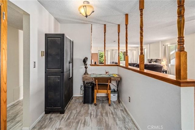14811 Elizabeth Lake Rd, Lake Hughes, CA 93532 - home office featuring healthy amount of natural light and a textured ceiling