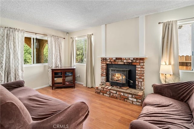 14811 Elizabeth Lake Rd, Lake Hughes, CA 93532 - living area featuring a textured ceiling, wood finished floors, and healthy amount of natural light