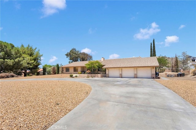 19428 Shasta Rd, Apple Valley, CA 92307 - single story home with driveway, an attached garage, and a chimney