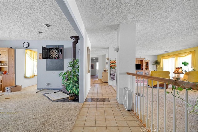 19428 Shasta Rd, Apple Valley, CA 92307 - corridor featuring tile patterned floors and a textured ceiling